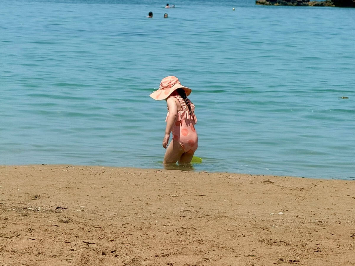 Chania beaches destination cards - girl in water on beach