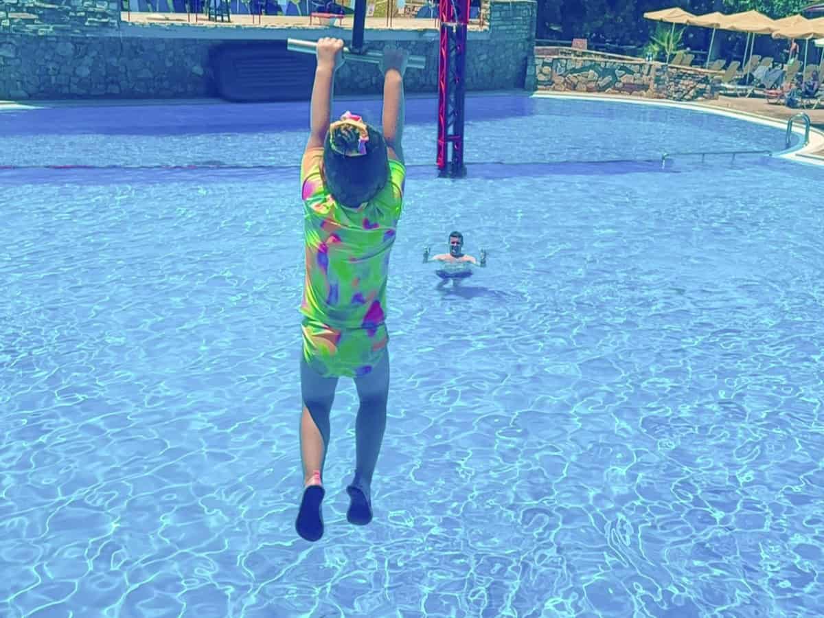 Chania water park destination cards - girl on water zip wire